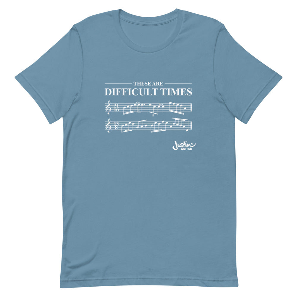 Steel blue shirt with 'These are difficult times' and music notation..