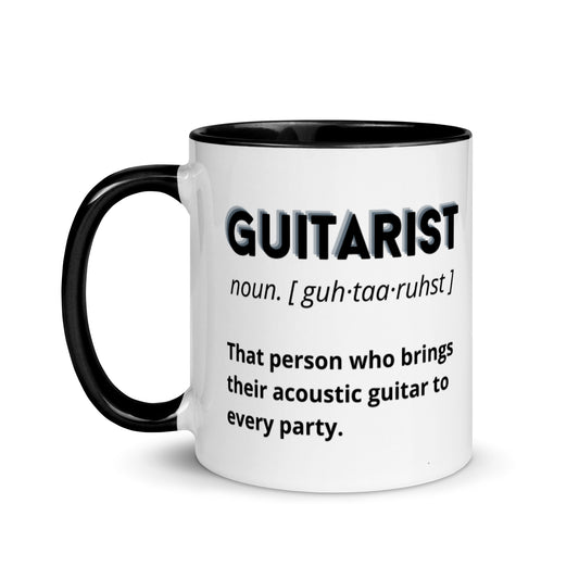 White mug with blue  inside and handle, with guitarist definition designs that describe ''That person who brings their acoustic guitar to every party' 