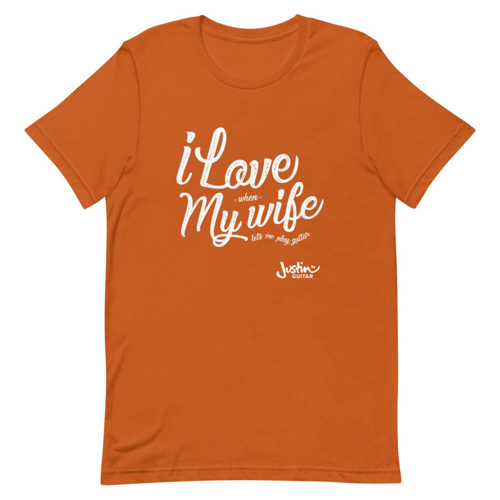 Orange tshirt with 'I love when my wife lets me play guitar' design.