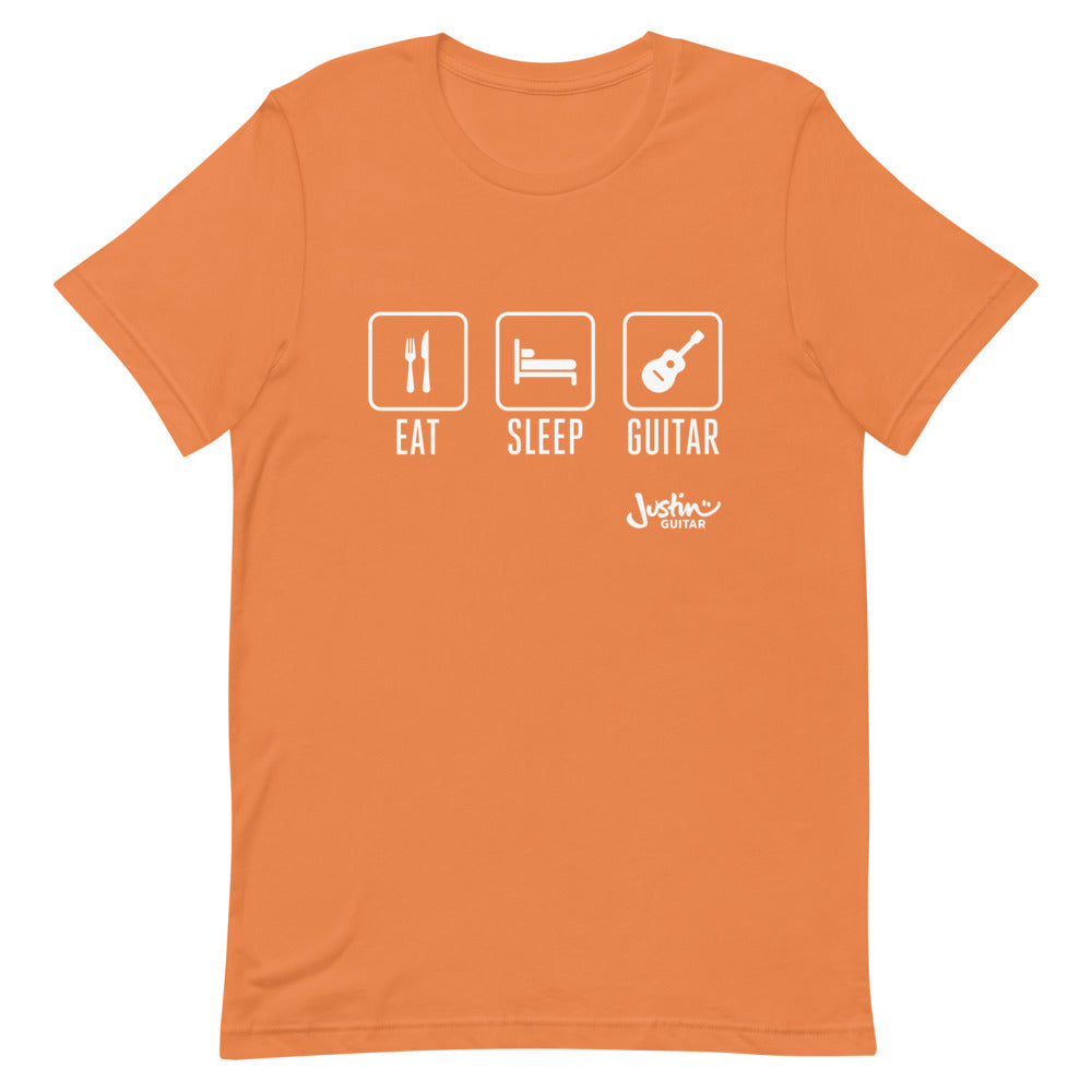 Orange T-shirt with a design that says 'Eat, Sleep, Guitar'.