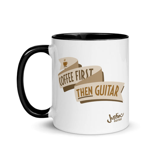 White coffee mug with black inside and handle with 'Coffee first, then Guitar' design.