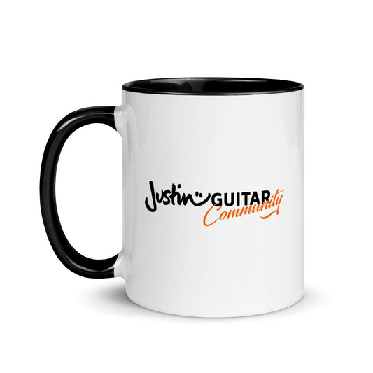 White mug with black inside and handle with JustinGuitar Community logo.