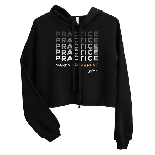 Black cropped hoodie with 'Practice makes permanent' design.